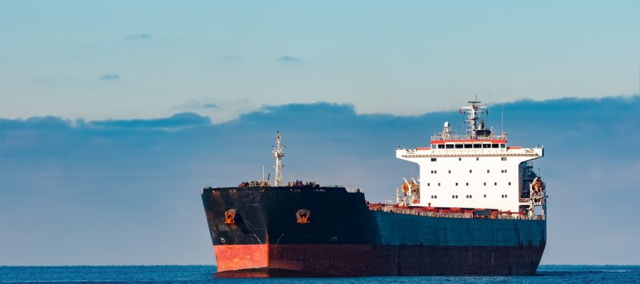 black-cargo-ship-moving-still-baltic-sea-water-riga-europe-min